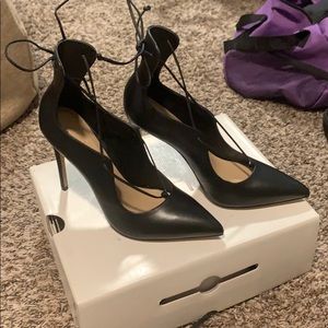 Brand new strapped black heel